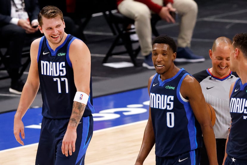 Dallas Mavericks guard Luka Doncic (77) and his teammates are all smiles as they leave the...