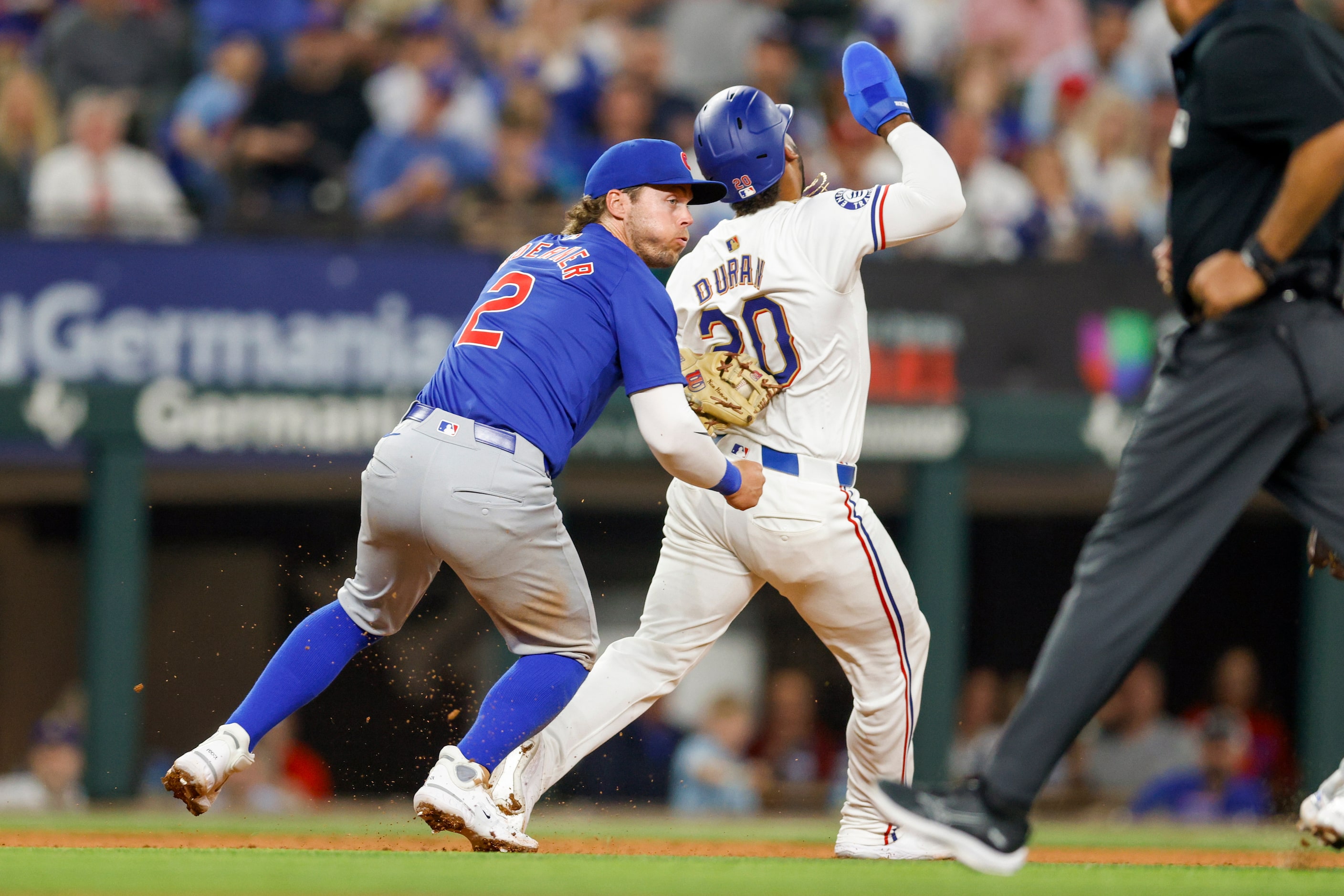 Chicago Cubs second baseman Nico Hoerner (2) tags Texas Rangers first baseman Ezequiel Duran...