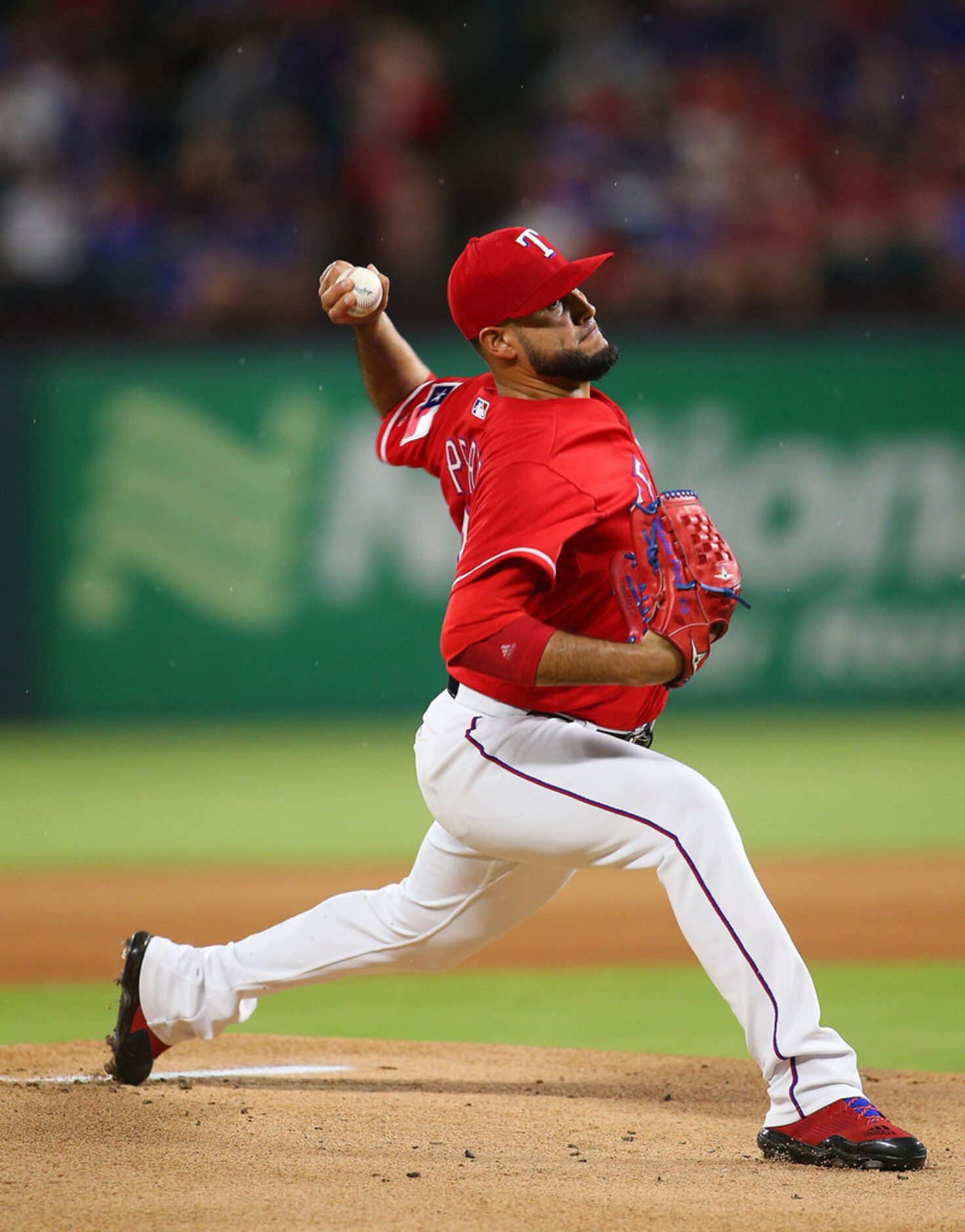 ARLINGTON, TX - AUGUST 18: Martin Perez #33 of the Texas Rangers throws in the first inning...