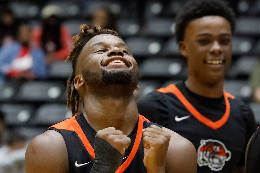 Lancaster High School guard Mike Miles (1) celebrates the moment as time expires with  a win...
