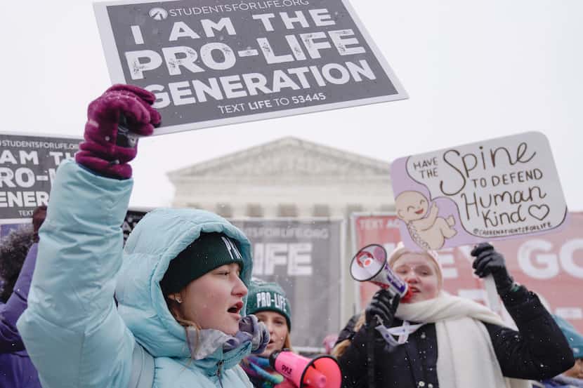 Anti-abortion activists participate in the annual March for Life in front of the Supreme...