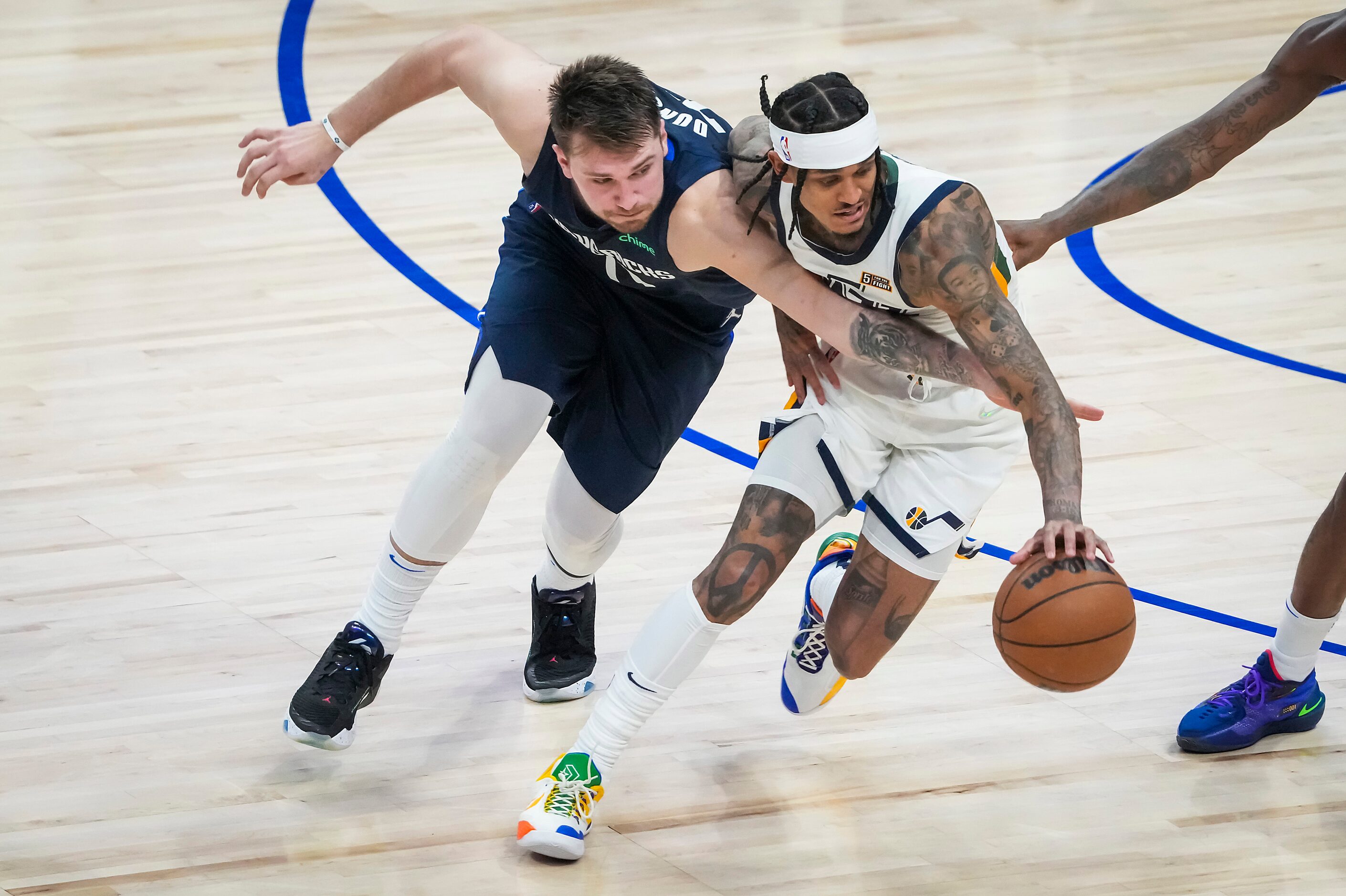 Dallas Mavericks guard Luka Doncic (77) goes for a steal against Utah Jazz guard Jordan...