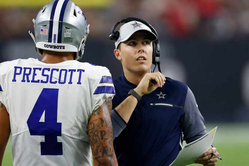 Dallas Cowboys quarterbacks coach Kellen Moore talks to Dallas Cowboys quarterback Dak...