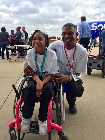 Duane and Tylar Davie flash a pair of smiles as they await departure for Disney World.