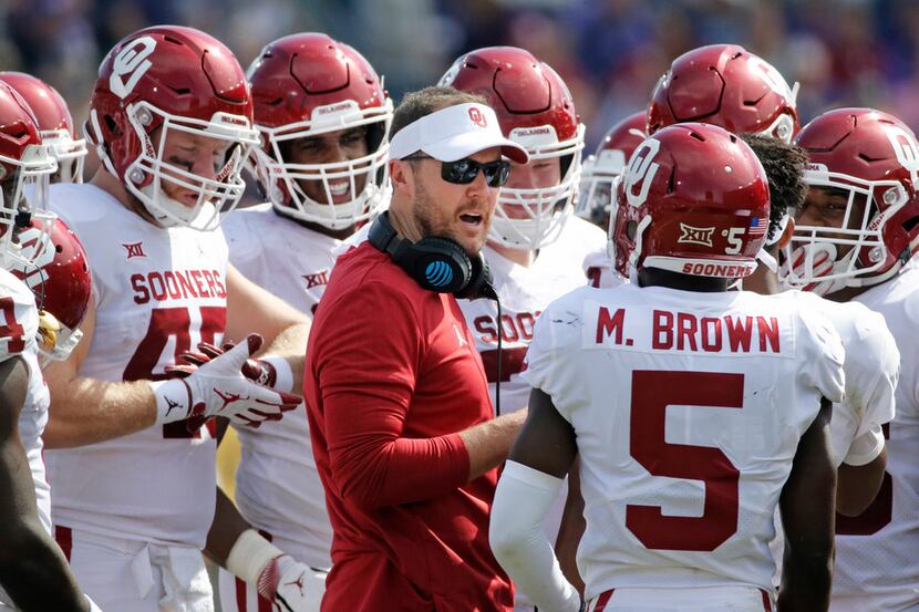 Oklahoma head coach Lincoln Riley talks with his team in the second half during the Oklahoma...