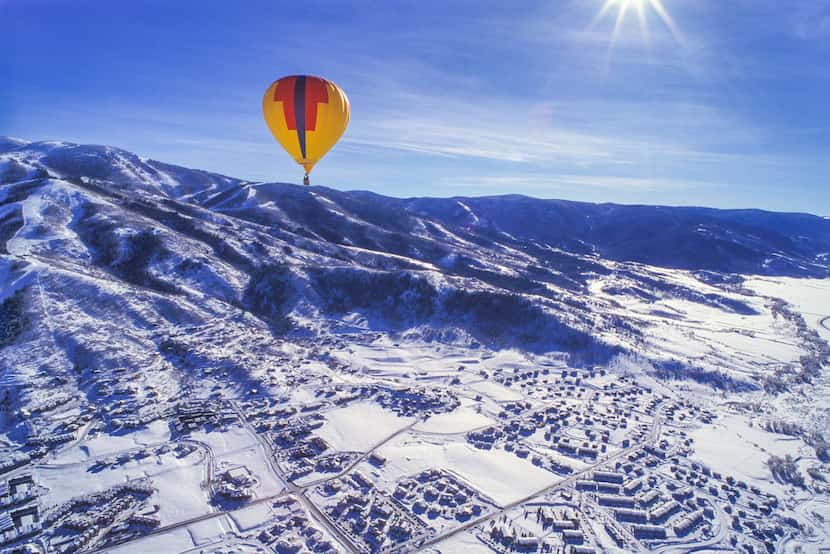 A hot-air balloon drifts high above Steamboat Springs, Colo..  In addition to skiing,...