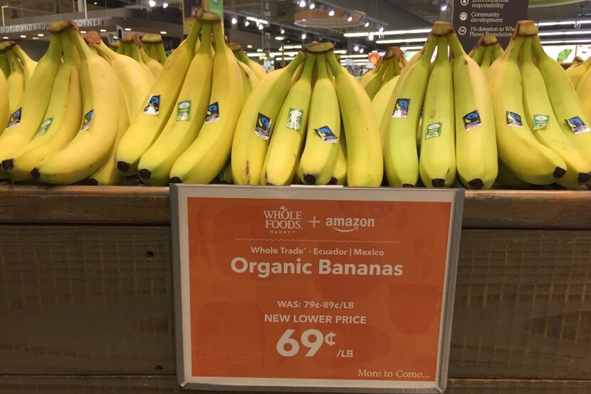 Whole Foods + Amazon price tag on organic bananas at the Whole Foods Market in Dallas on...