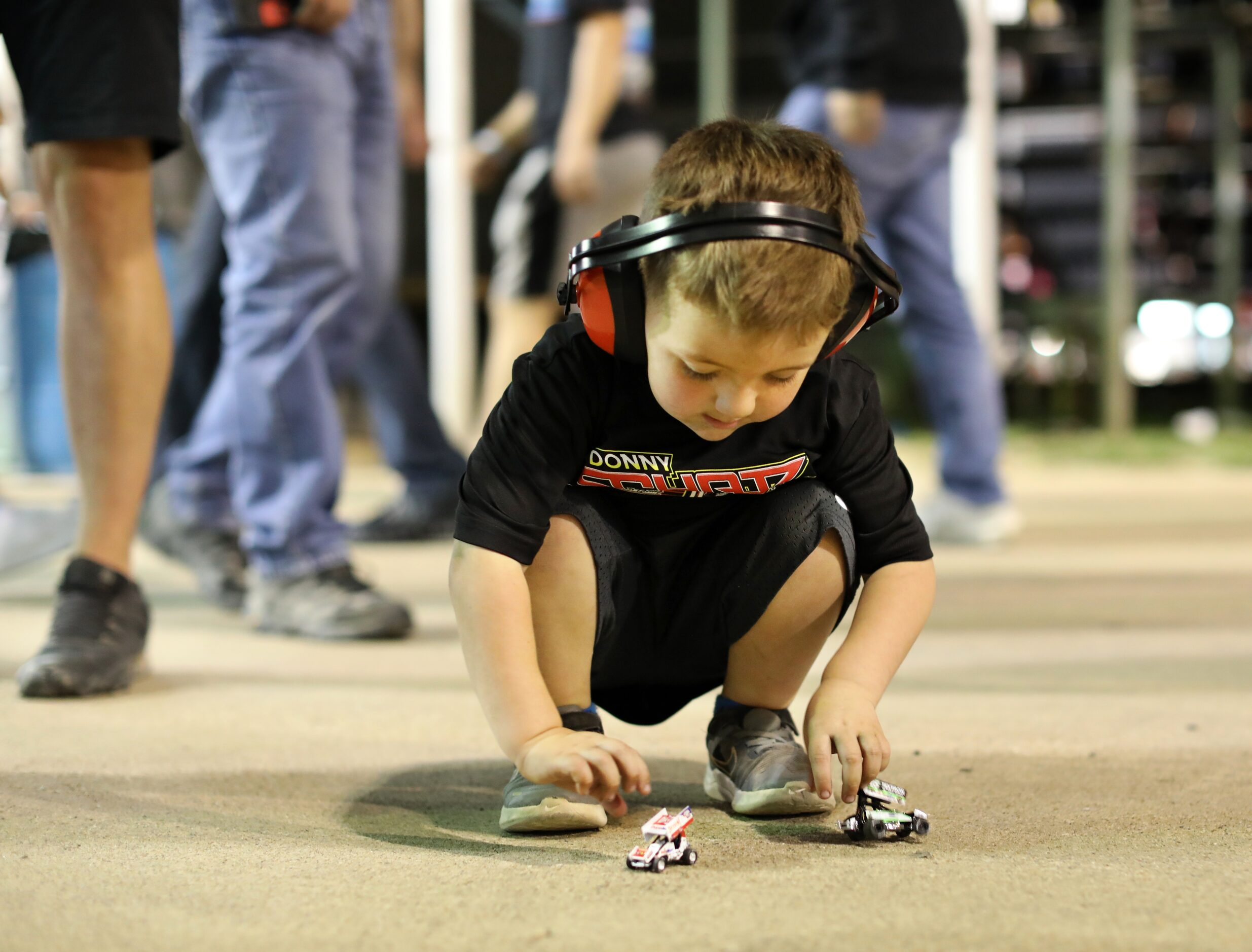 4-year-old Easton Obregon plays with his toy sprint cars at Devil's Bowl Speedway. (Jason...