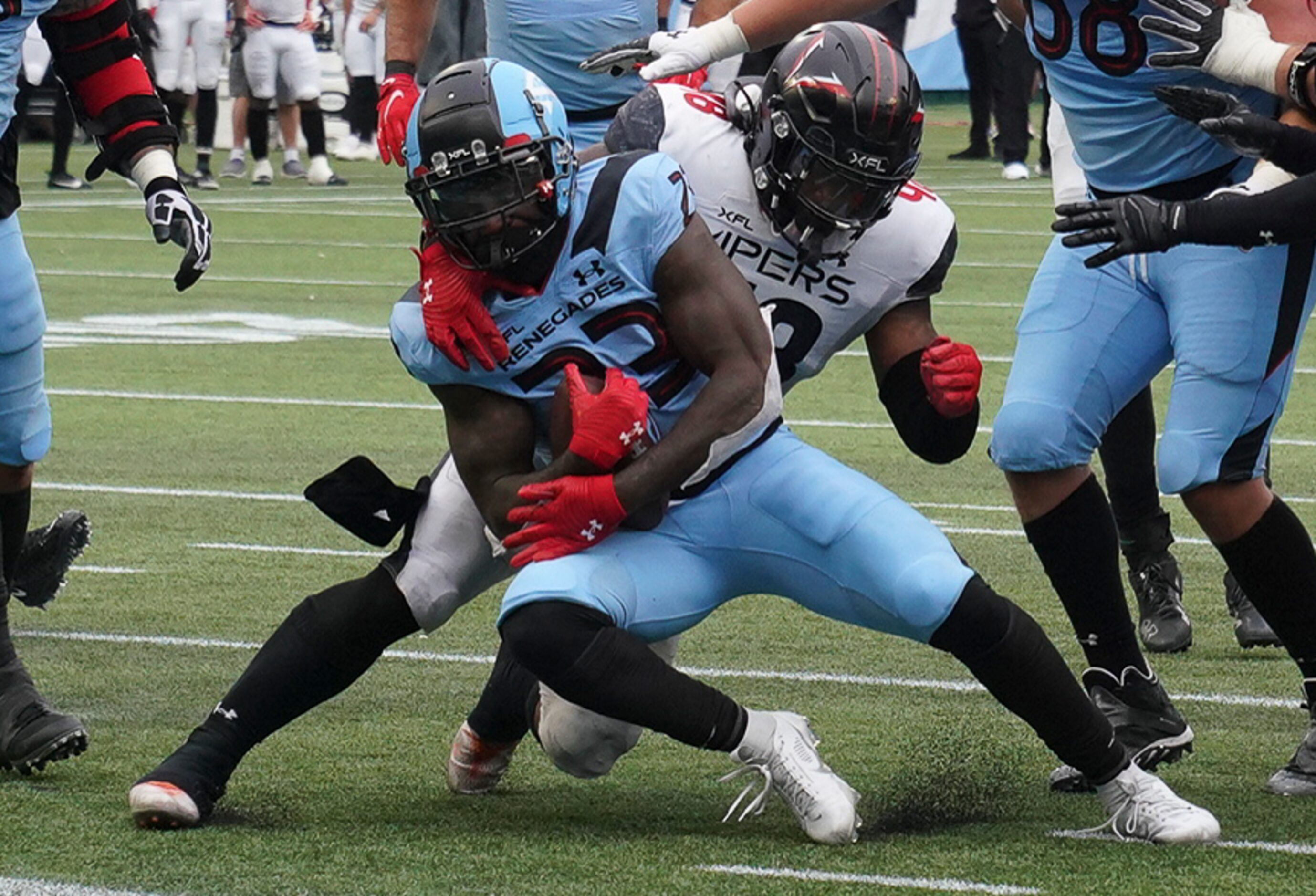 Vegas Vipers linebacker D.J. Calhoun (48) tackles Arlington Renegades running back Keith...