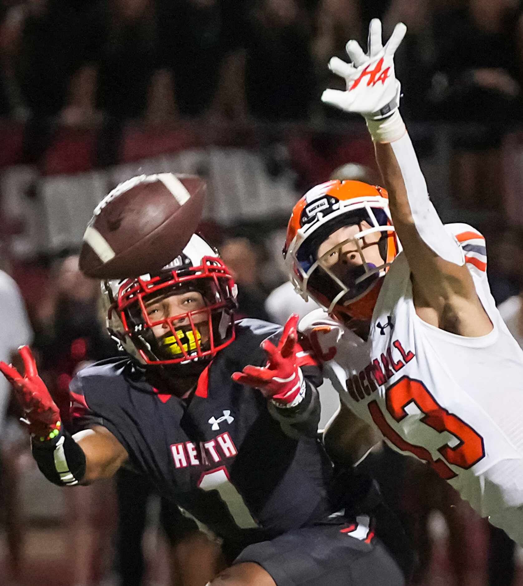 Rockwall defensive back Cadien Robinson (13) breaks up a pas intended for Rockwall-Heath...