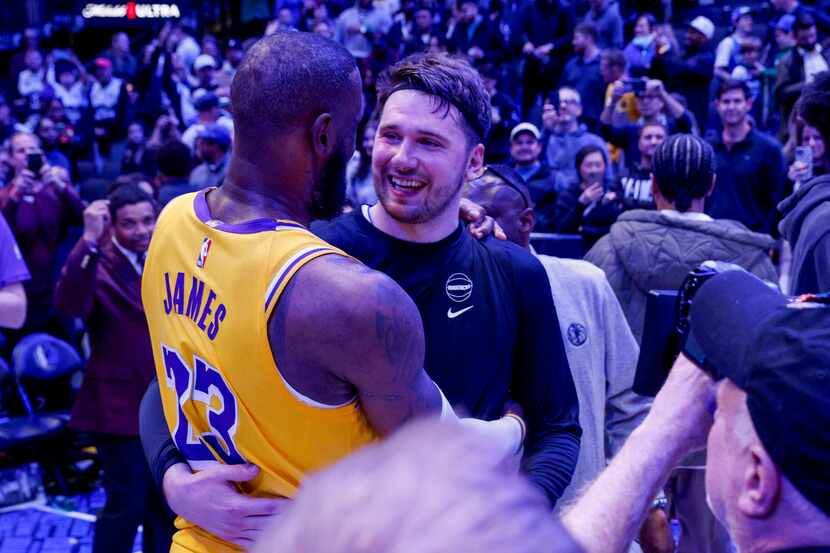 Los Angeles Lakers forward LeBron James (23) talks with Dallas Mavericks guard Luka Doncic...