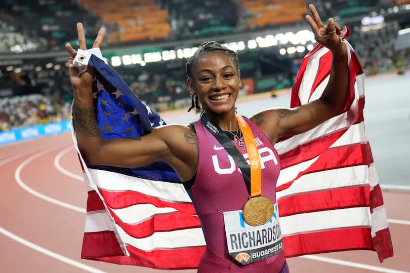 Sha'Carri Richardson, of the United States, poses after winning the gold medal in the...