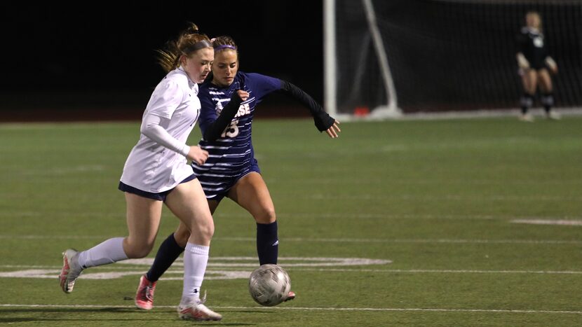 Wylie East High School player #19, Karlee Leary, and Sachse High School player #13, Clara...