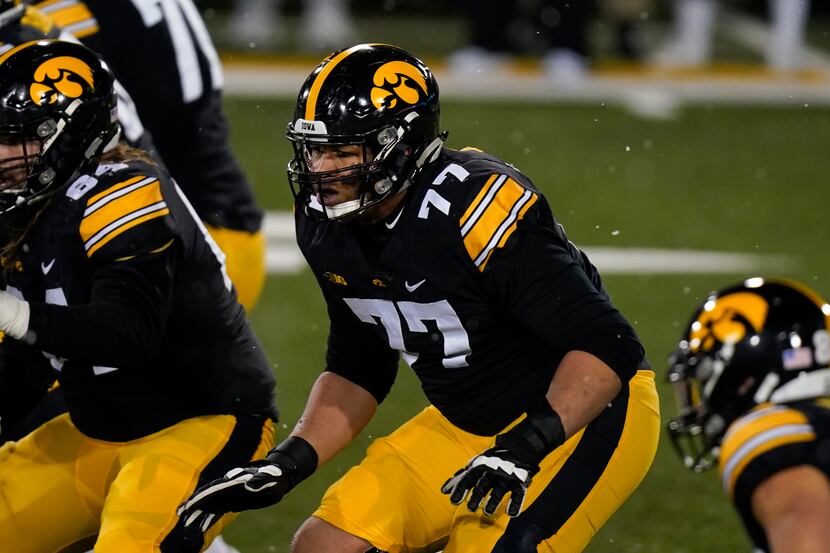 Iowa offensive lineman Alaric Jackson (77) looks to make a block during the second half of...