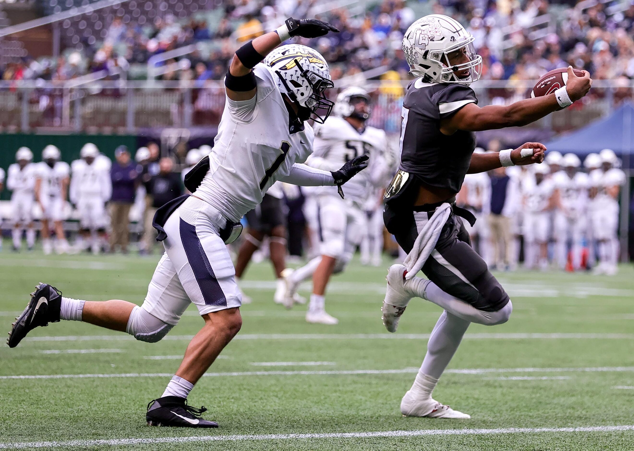 Lewisville quarterback Ethan Terrell, (right) avoids Keller defensive back Matthew Anderson...