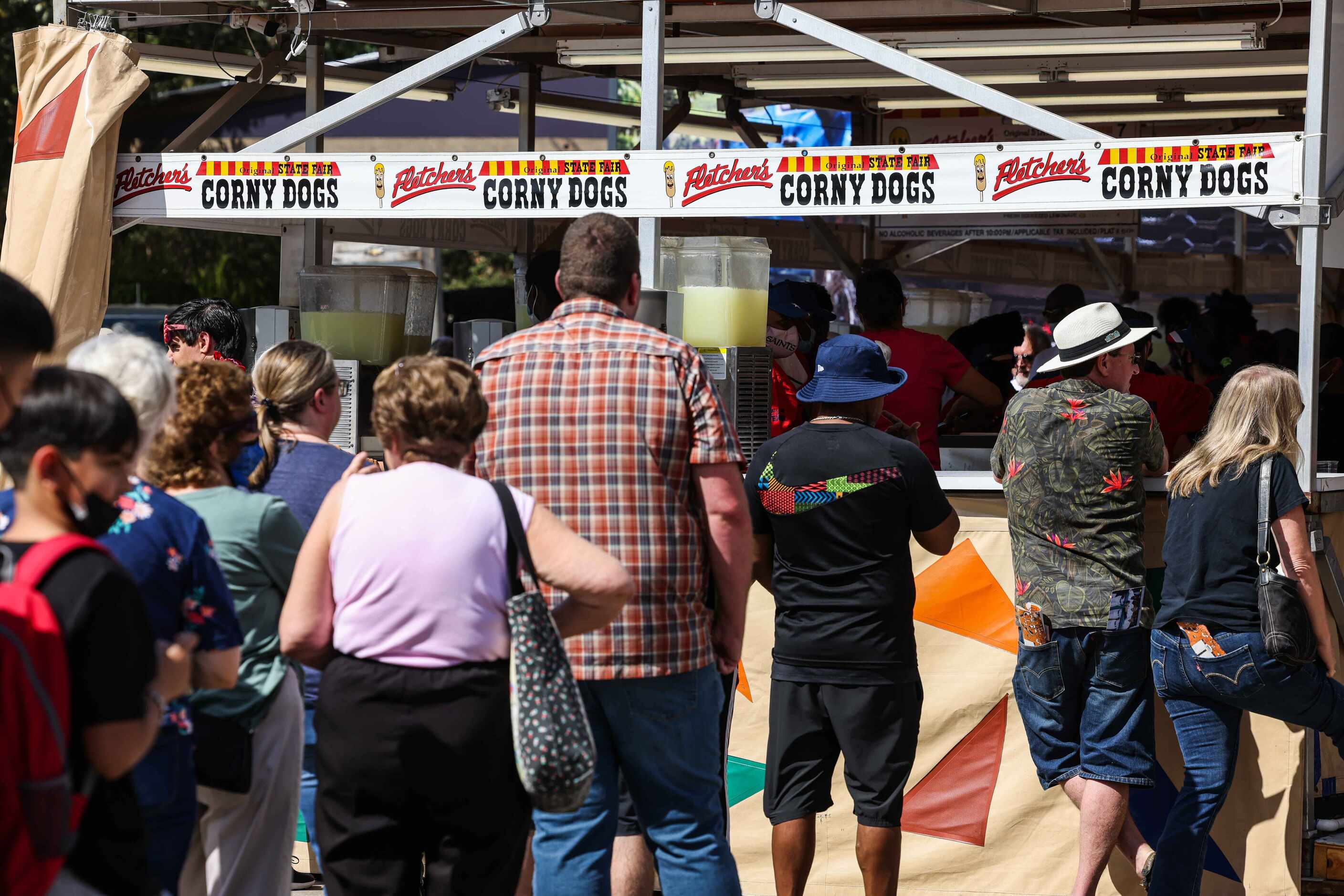 People in line to have a Fletcher's CornyDogs at the State Fair of Texas during its opening...