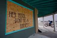 A message for Beryl is left on a boarded up business, Sunday, July 7, 2024, in Rock Port,...