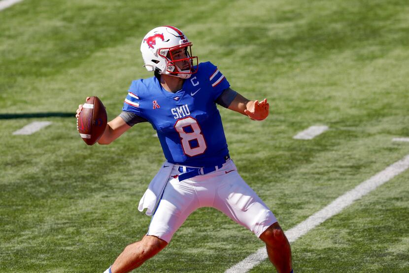 SMU quarterback Tanner Mordecai (8) throws a 43 yard pass to wide receiver Jordan Kerley (1)...