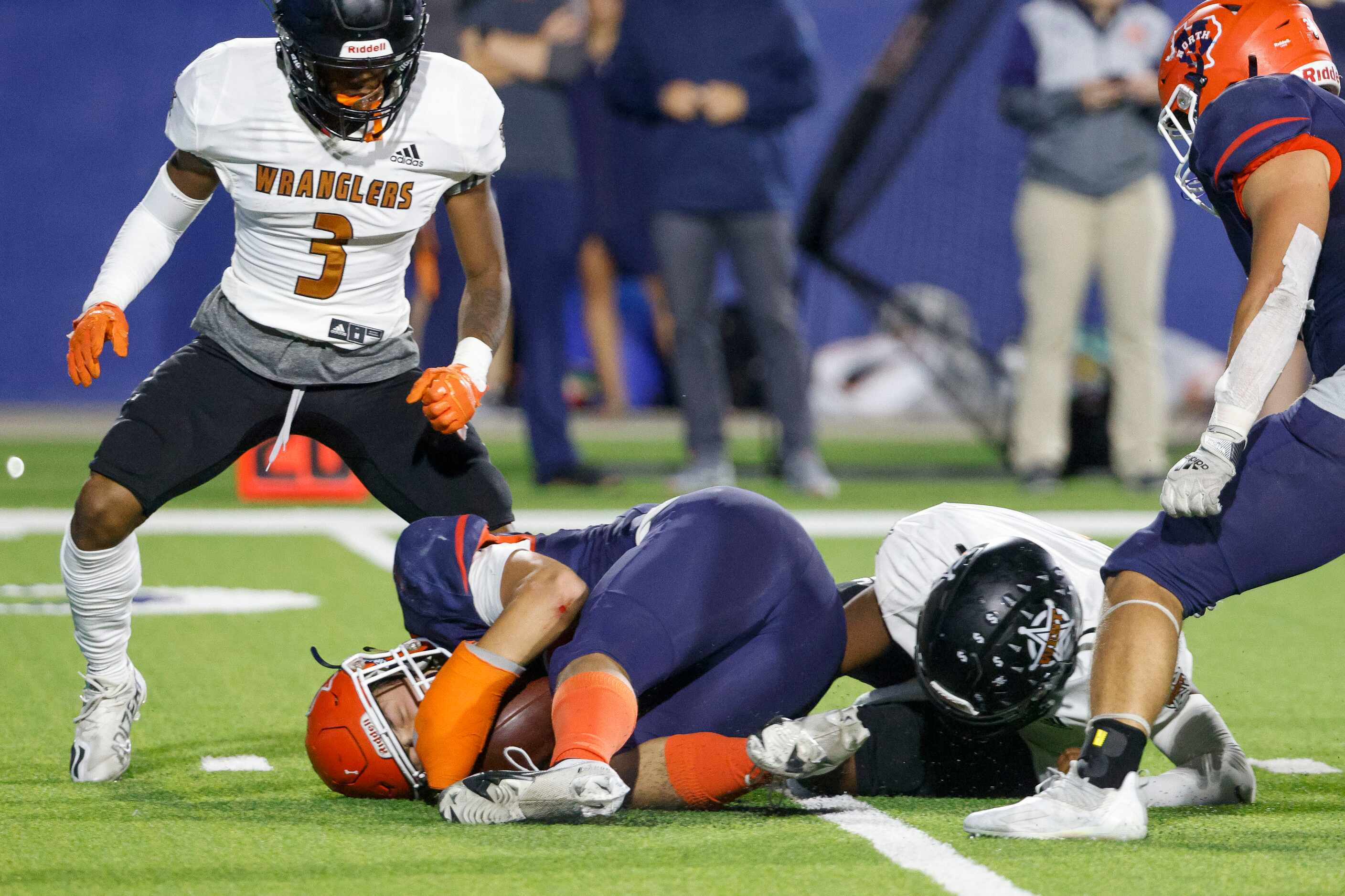McKinney North linebacker Andrew McGee (10) recovers a fumble ahead of West Mesquite...