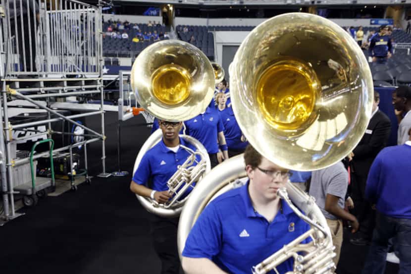 University of Kansas band members Kasil Brenner (right) and Basil Zimucha enter with their...
