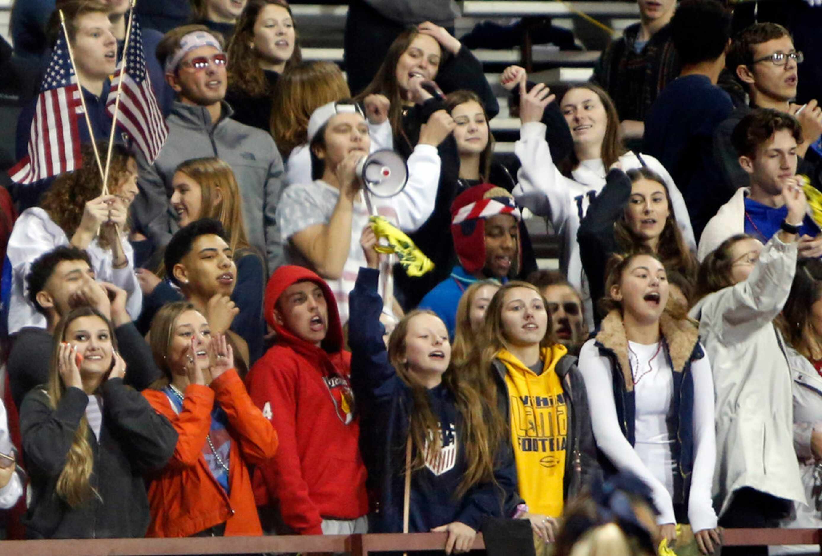 Arlington Lamar fans filling the student section cheer the Vikings during a fourth quarter...