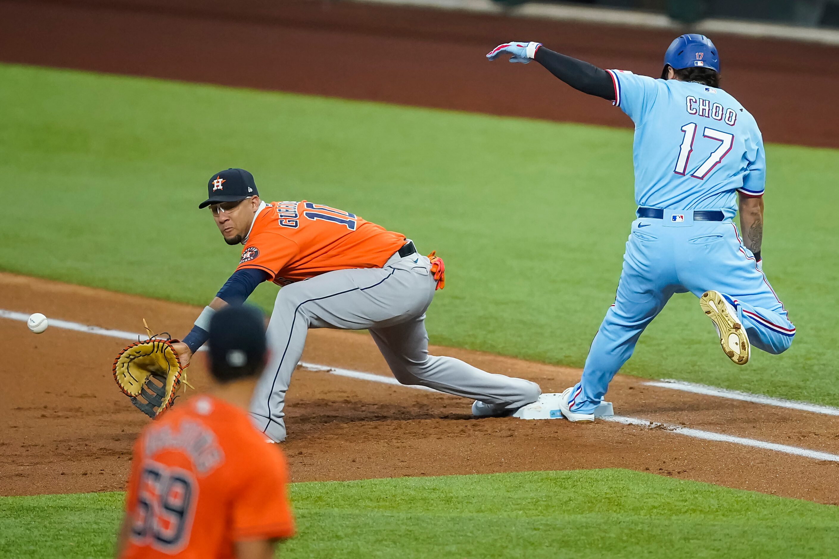 Texas Rangers designated hitter Shin-Soo Choo beats the throw to Houston Astros first...