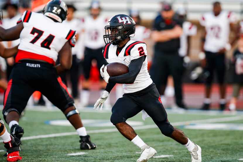 Lake Highlands senior running back Noelle Whitehead (2) carries the ball during the first...