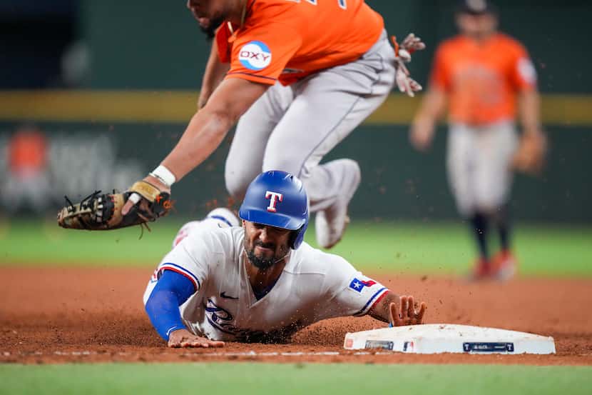 Texas Rangers second baseman Marcus Semien is doubled off first base by Houston Astros first...