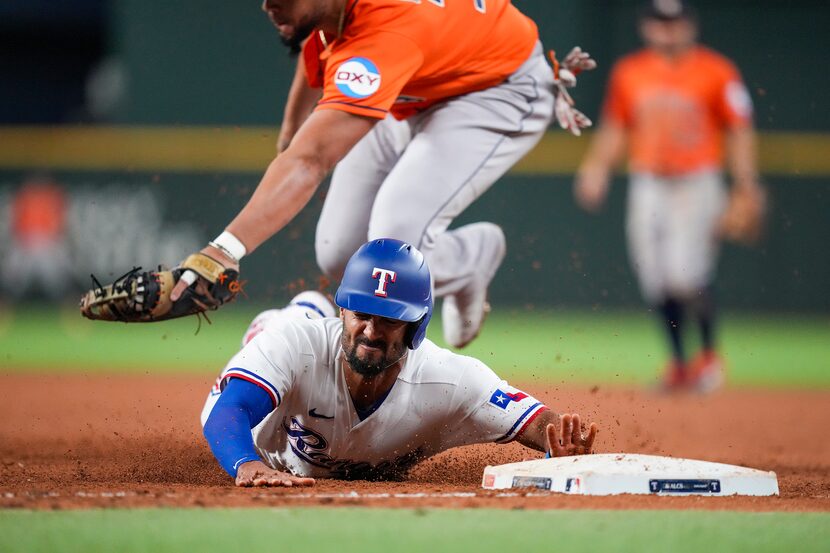 Texas Rangers second baseman Marcus Semien is doubled off first base by Houston Astros first...