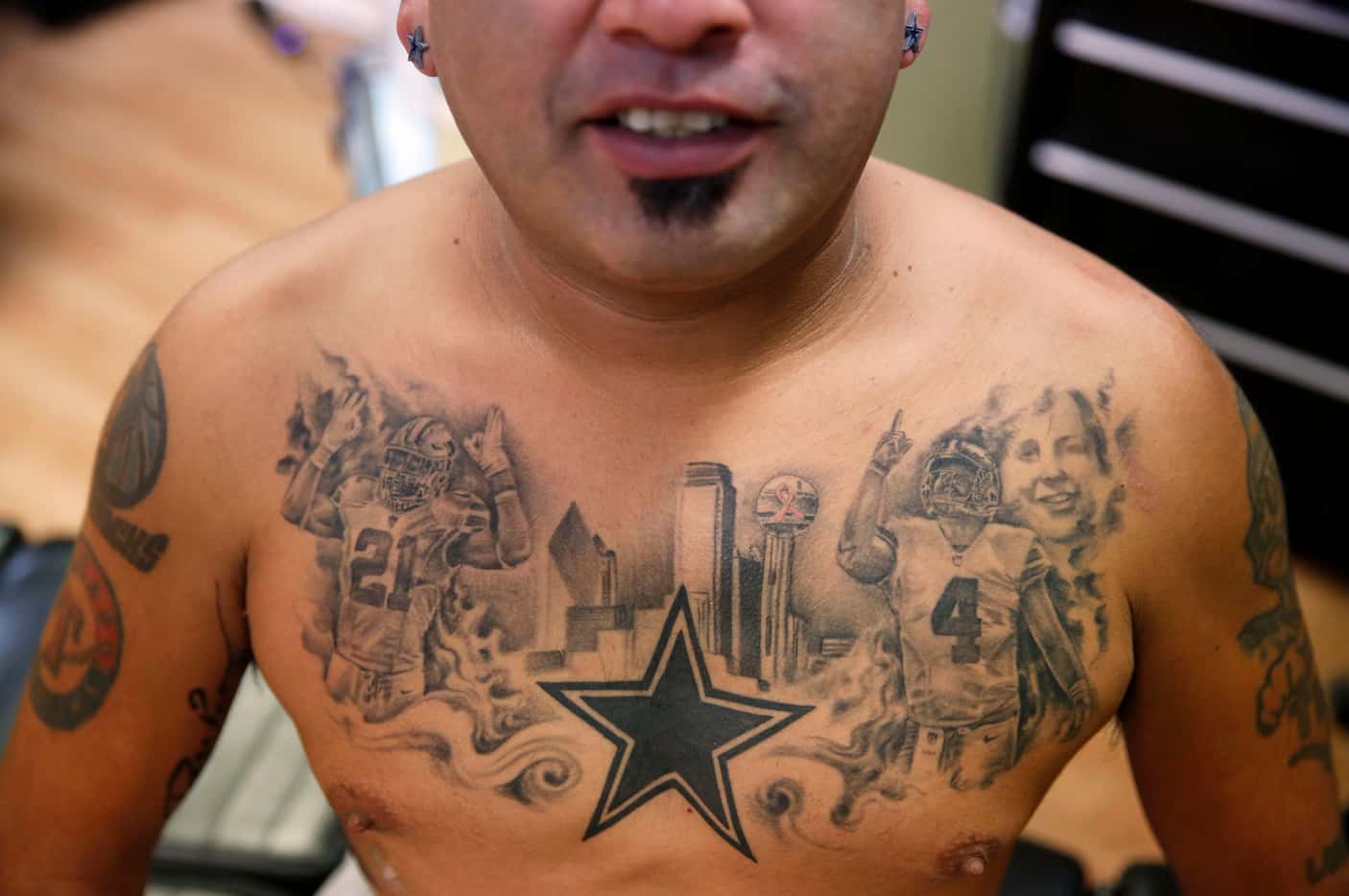 Raymond "Cowboy" Ortiz shows his chest tattoo featuring Dallas Cowboys rookies Ezekiel...