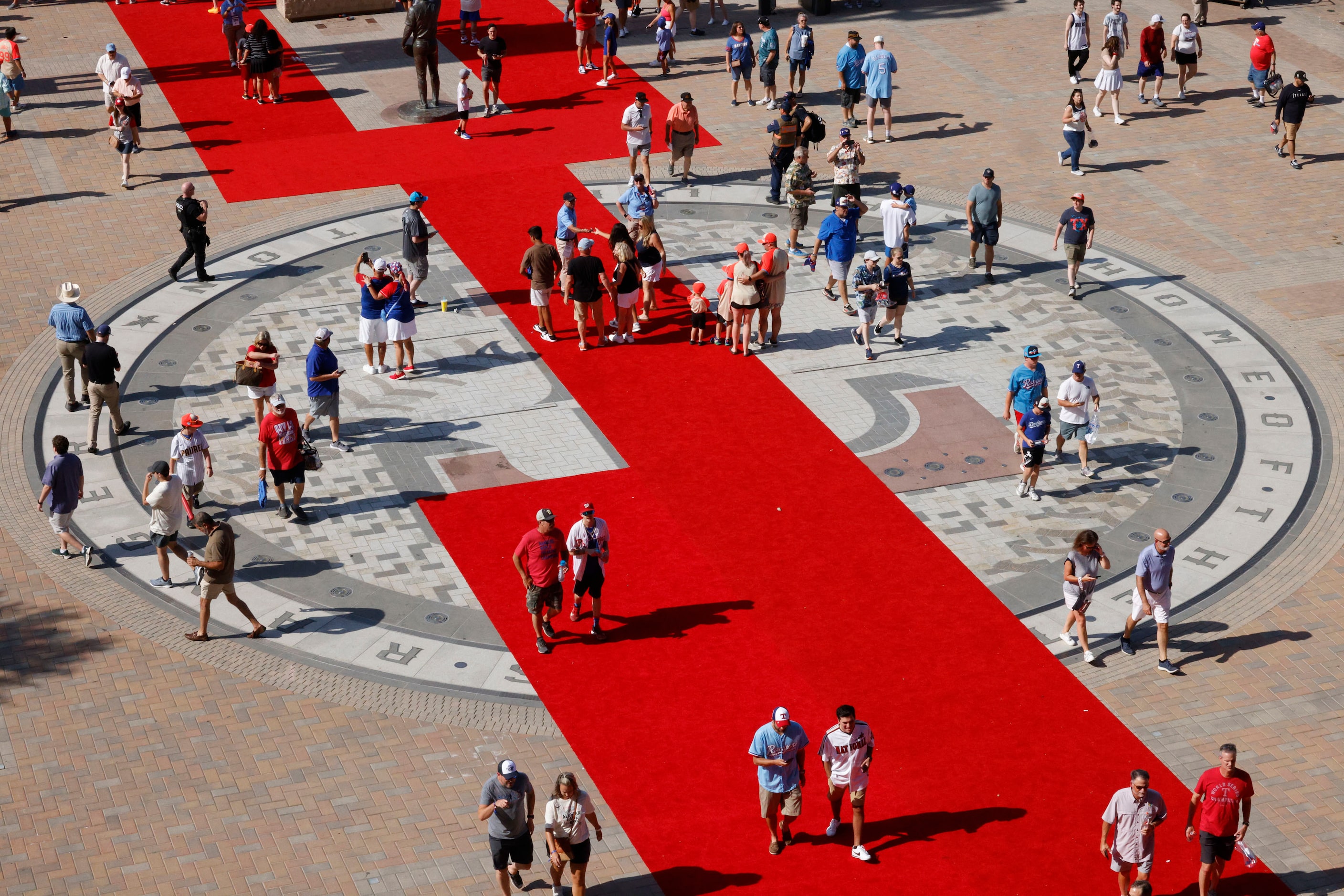 Fans arrive at Globe Life Field, Tuesday, July 16, 2024, in Arlington, before the MLB...