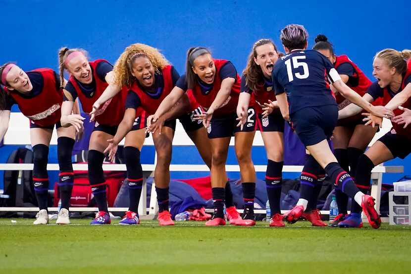 USA forward Megan Rapinoe celebrates with teamates after scoring on a free kick during the...