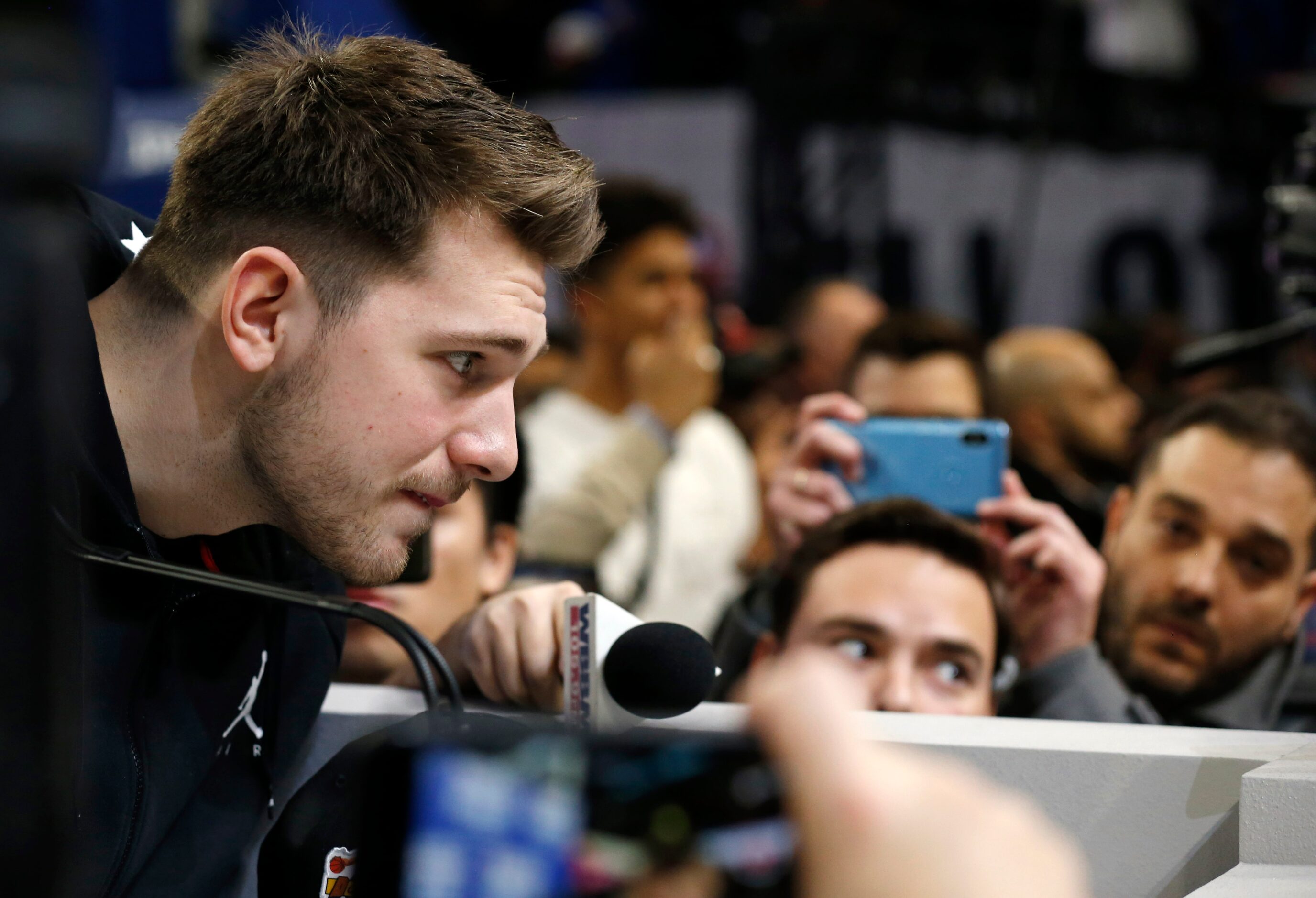 Team LeBron's Dallas Mavericks forward Luka Doncic (2) leans forward as he listens to a...