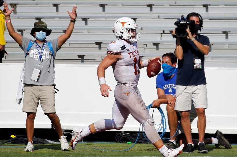 Texas Longhorns quarterback Sam Ehlinger (11) runs in a touchdown during the second overtime...