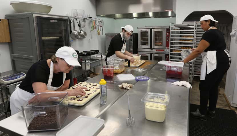 In the kitchen, executive baker Judé Routh (left) and the staff stay busy making kolaches at...