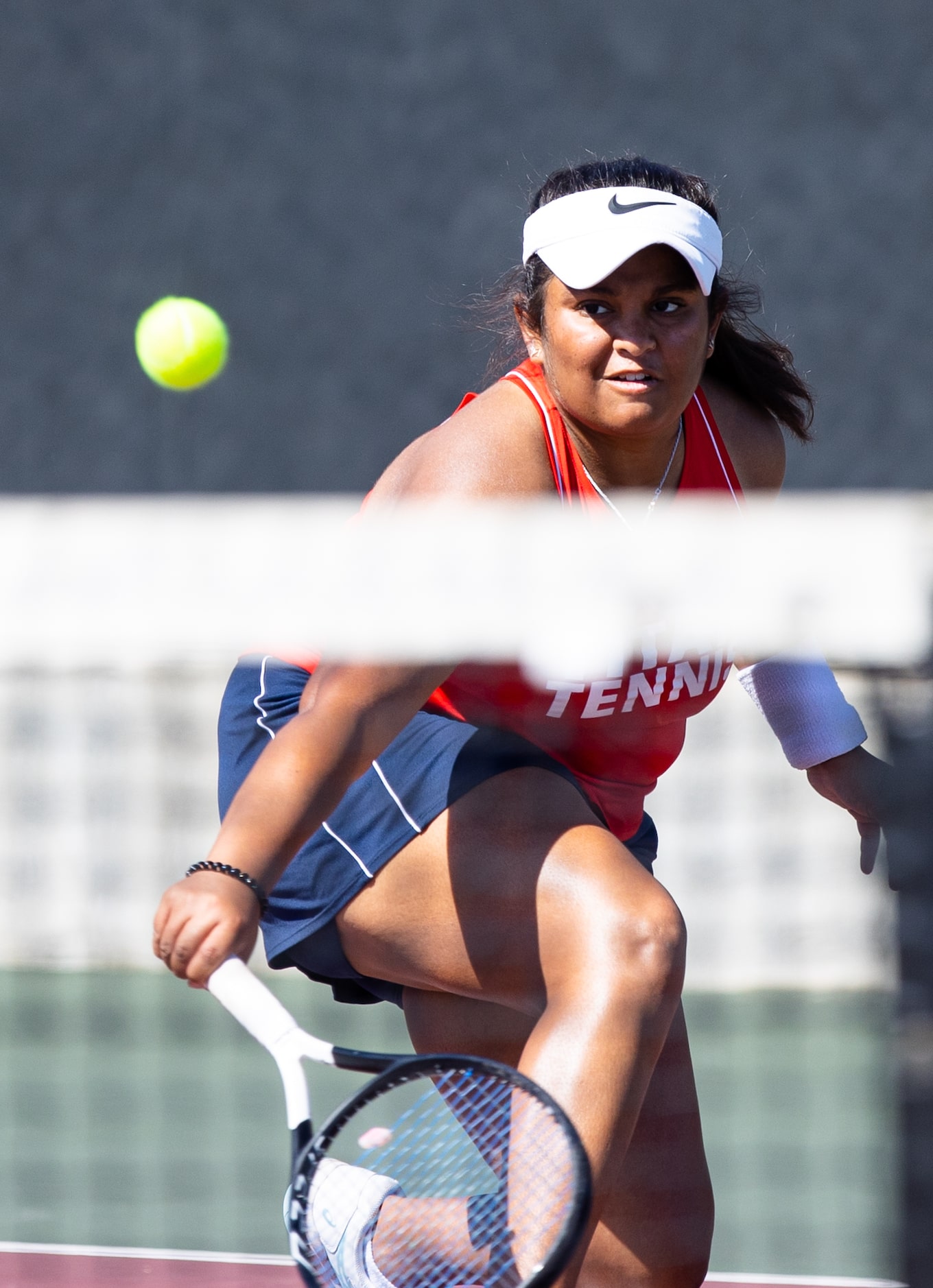 Frisco Centennial’s Aashikha Basappa returns a shot during a mixed doubles match with...