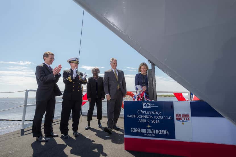 Georgeann McRaven christens the USS Ralph Johnson, a guided missile  destroyer, on her first...