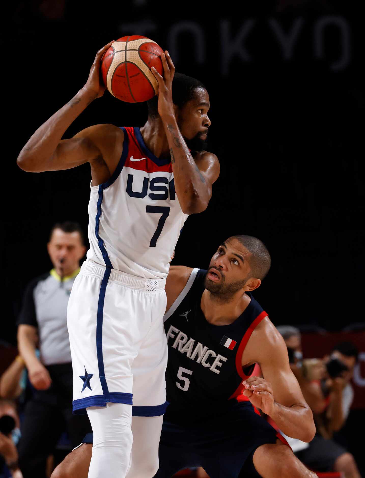 USA’s Kevin Durant (7) is defended by France’s Nicolas Batum (5) during the second half of...