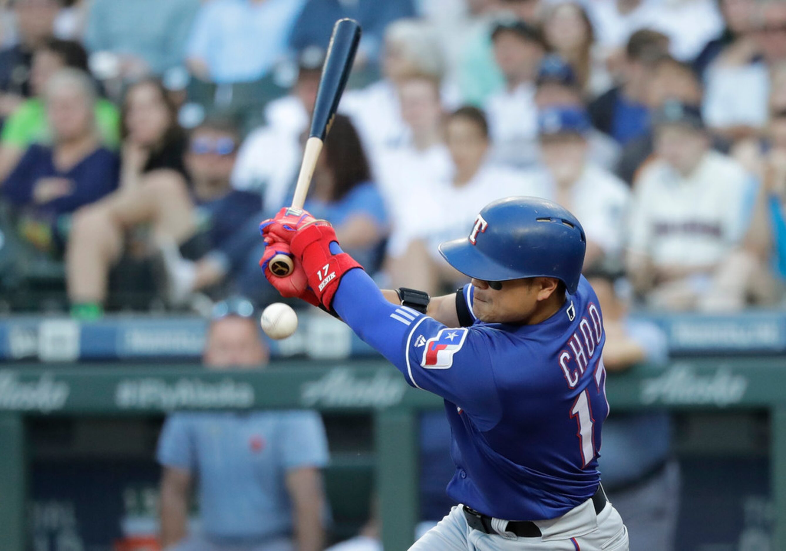 Texas Rangers' Shin-Soo Choo fouls a ball during the fifth inning of a baseball game against...