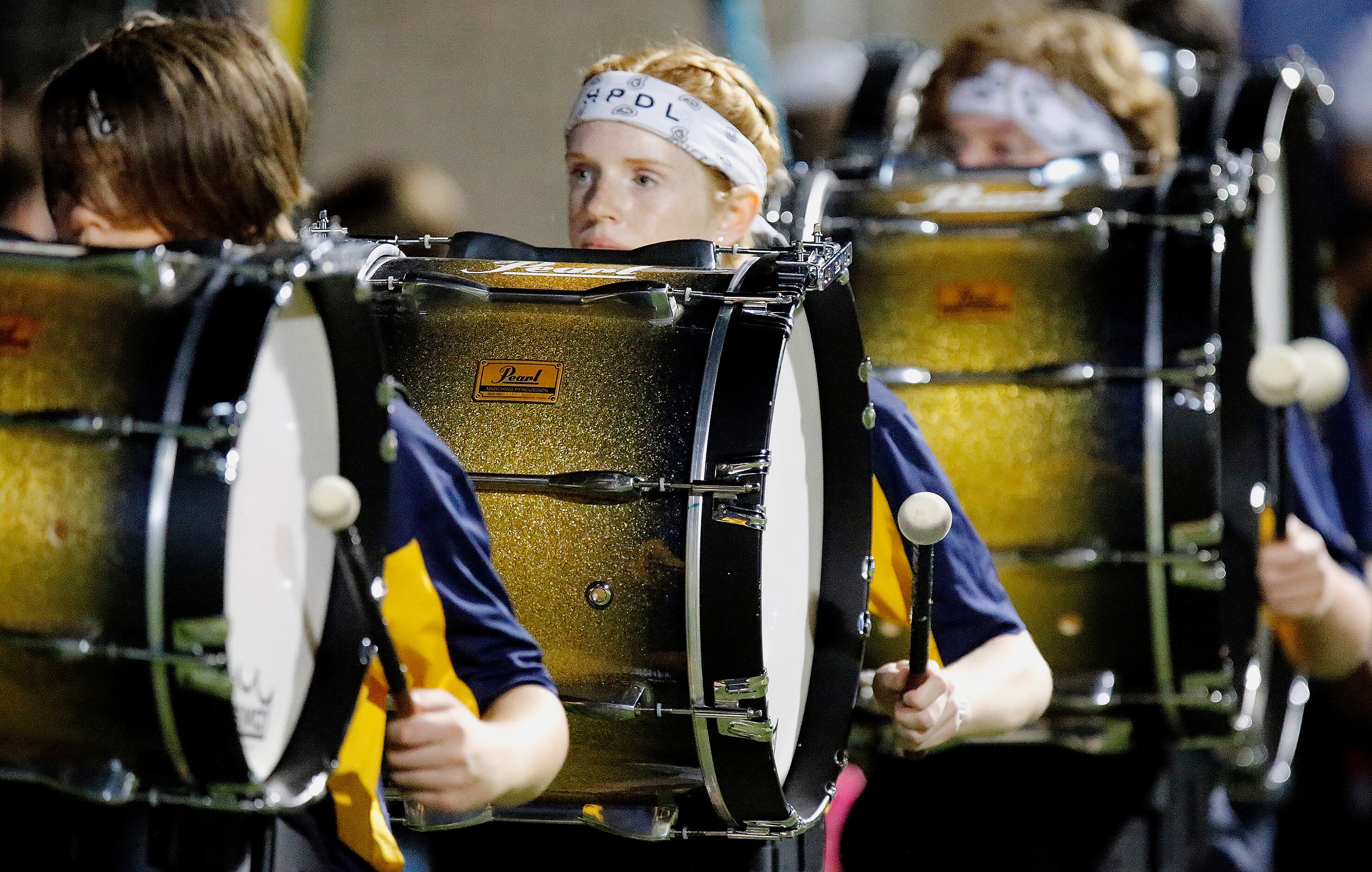The Highland Park High School marching band gets ready to perform at half time as Highland...