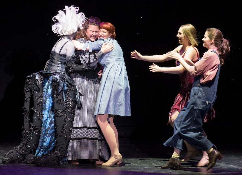 Mansfield High School's Shelby Priddy (second from left) is  hugged by her fellow nominees...