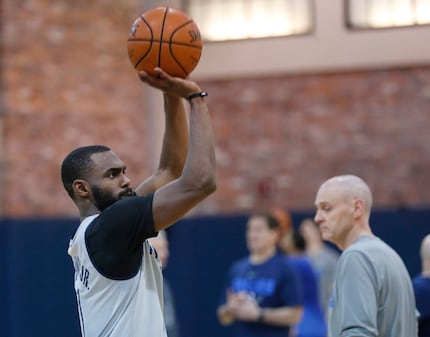 Tim Hardaway Jr. (11) works on free throws during practice at American Airlines Center in...