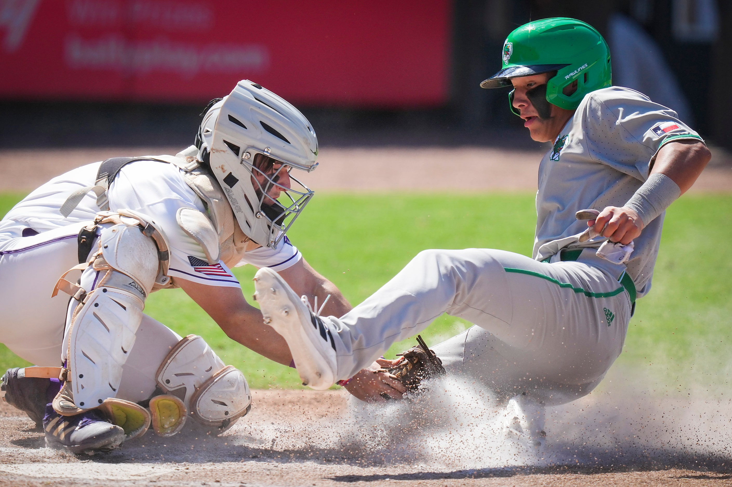 Southlake Carroll shortstop Ethan Mendoza is out at home as Fort Bend Ridge Point catcher JJ...