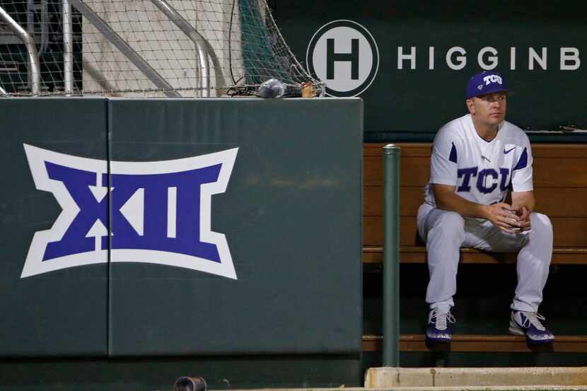 TCU coach Jim Schlossnagle sits in the dugout during the first inning against Central...