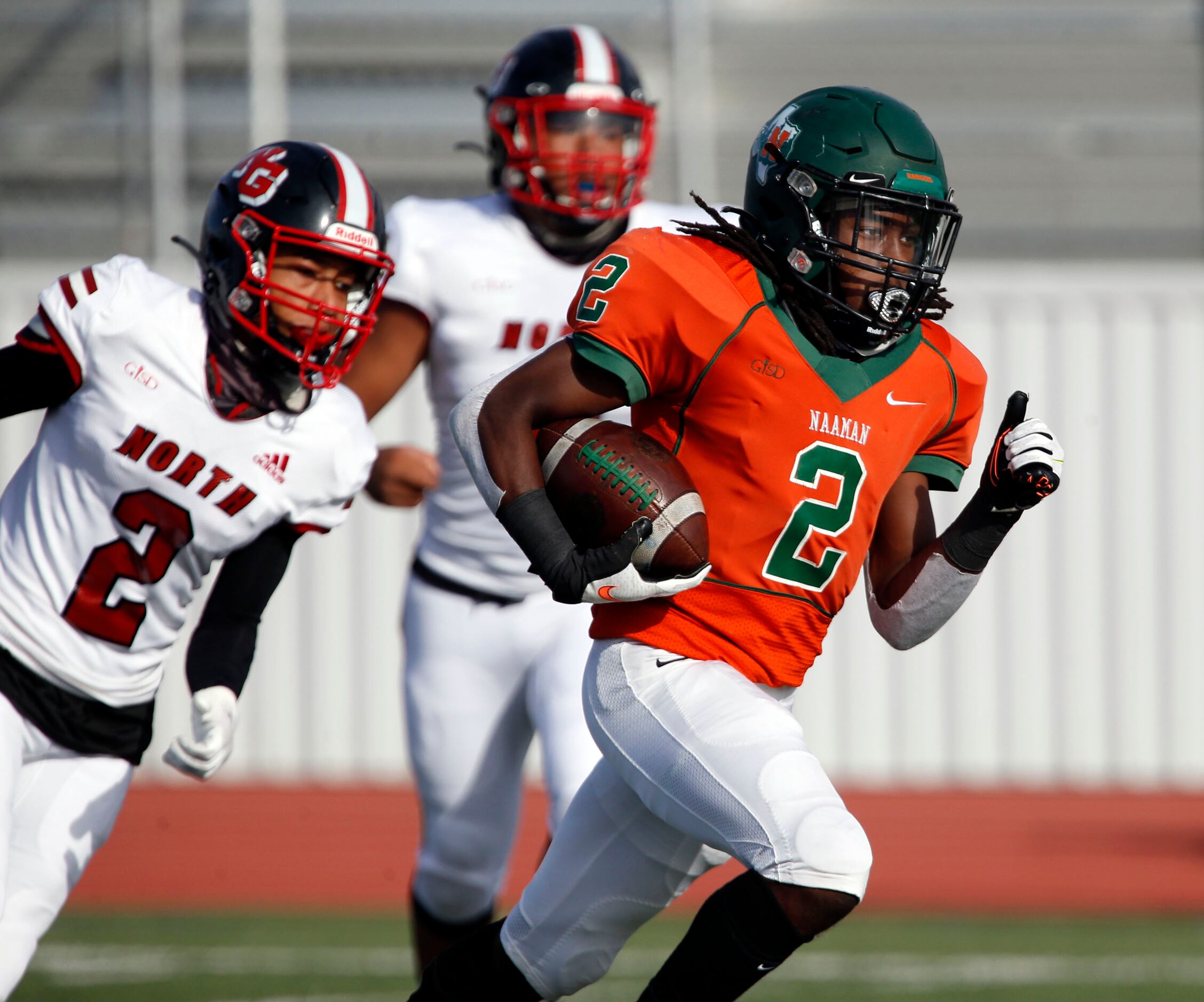 Naaman Forest’s Kingsley Bennett (2) heads to the end zone for touchdown during the first...