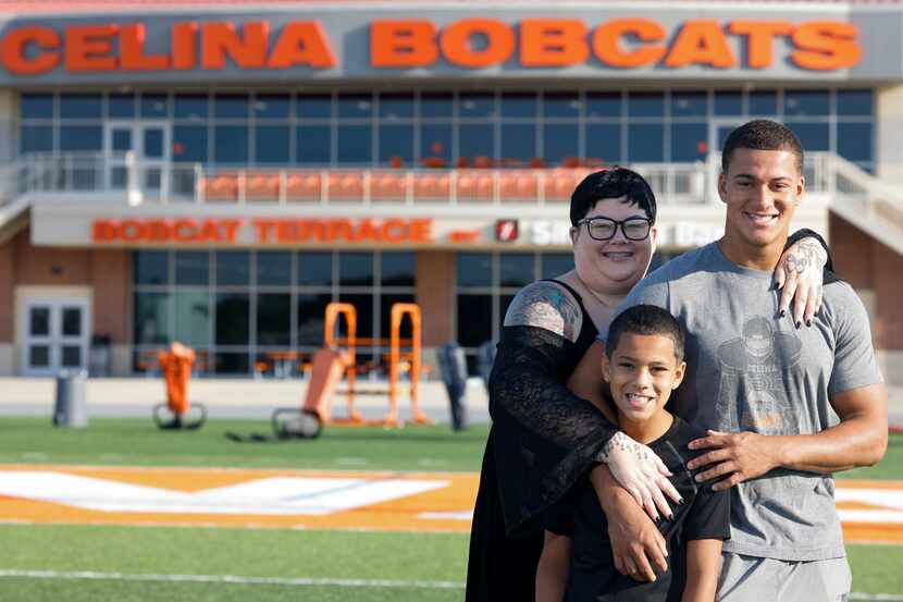 Celina High School's running back Gabe Gayton, right, stands on the football field with his...