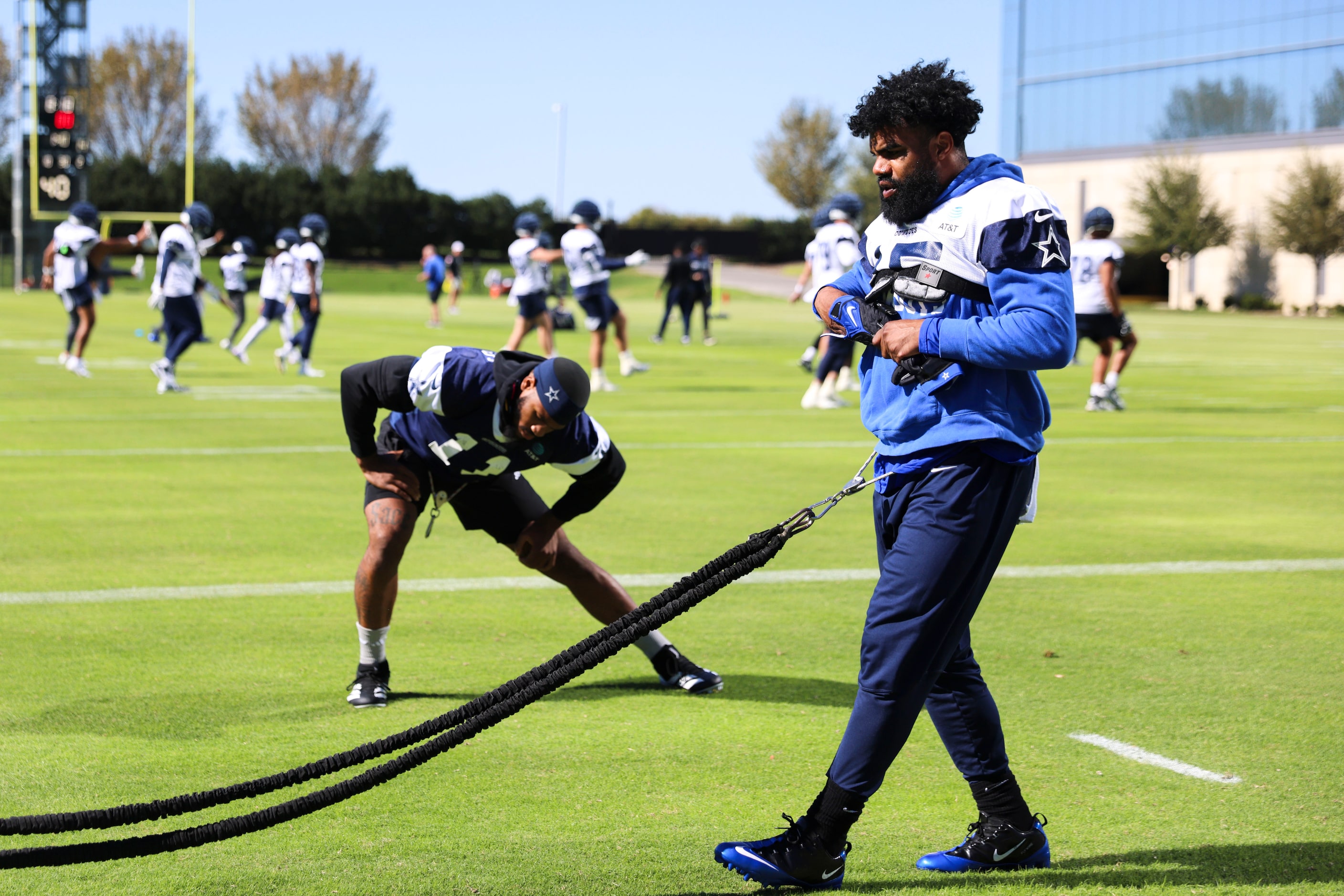 Dallas Cowboys running back Ezekiel Elliott (right) and  linebacker Micah Parsons warms up...