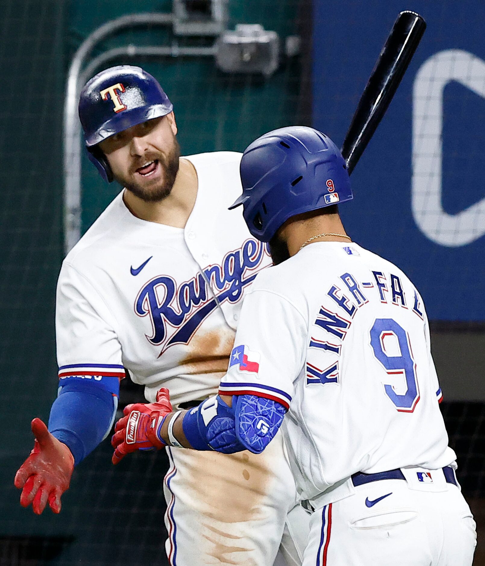 Texas Rangers center fielder Joey Gallo (13) congratulates Isiah Kiner-Falefa (9) on his...