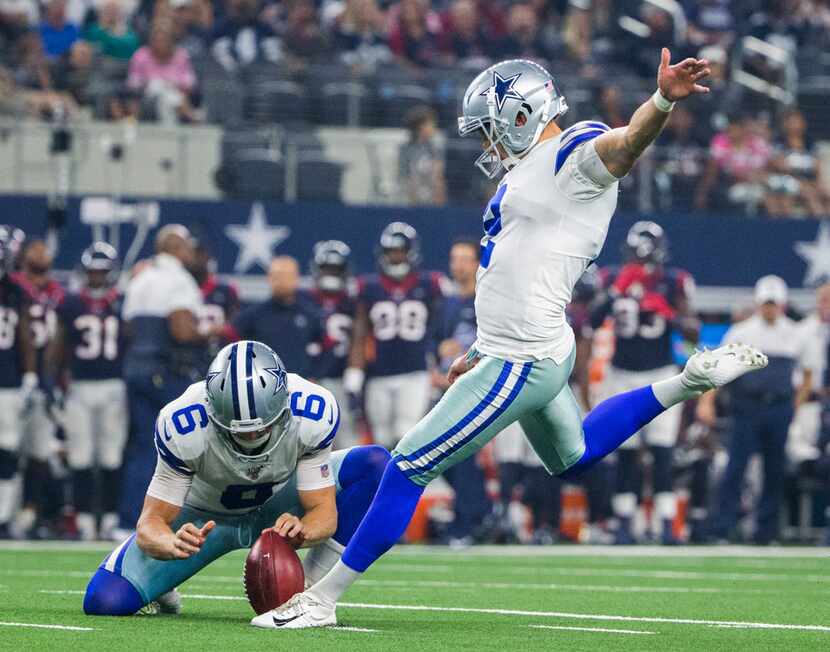 Dallas Cowboys kicker Brett Maher (2) kicks an extra point field goal during the first...