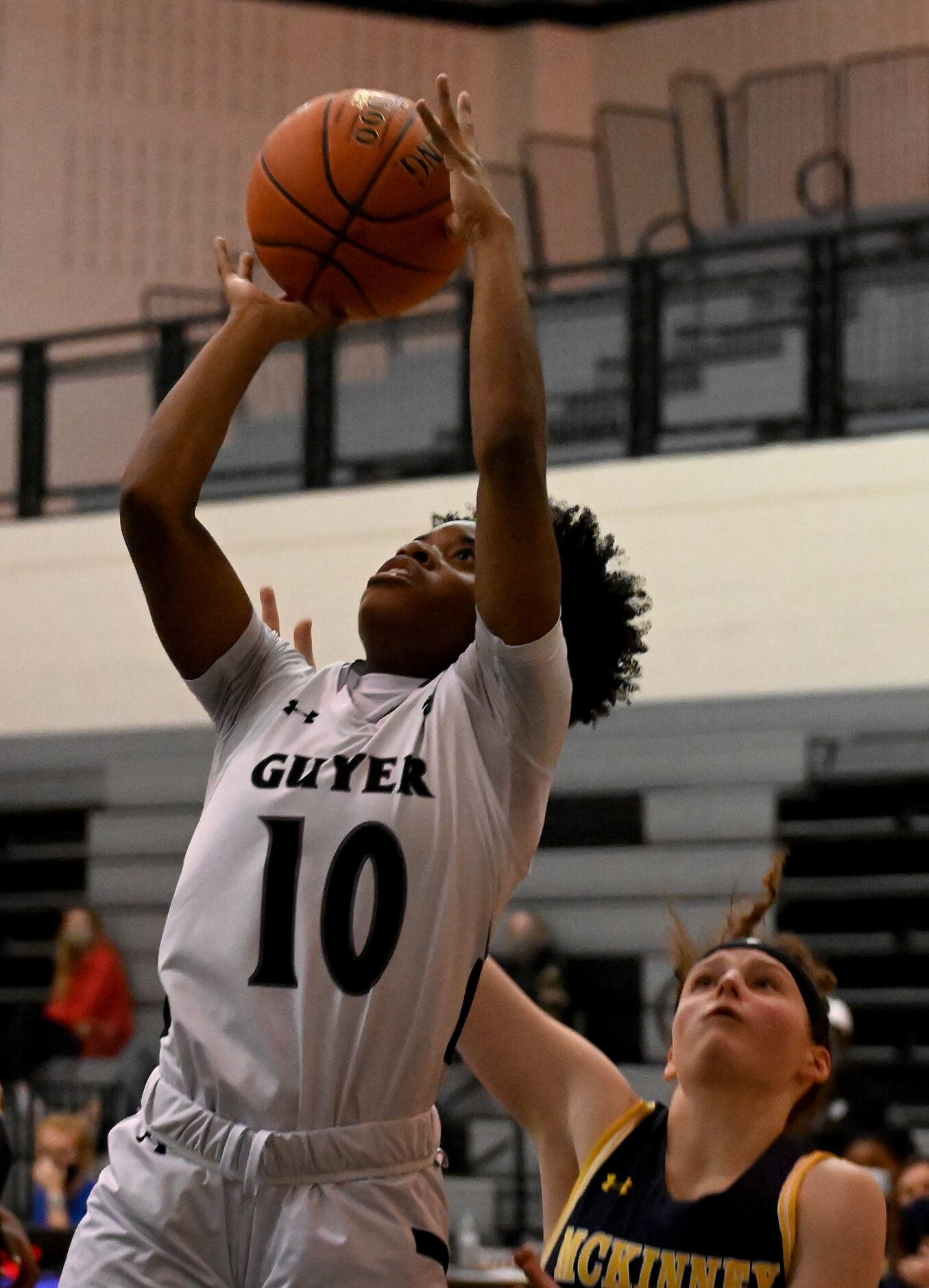 Denton Guyer’s Hailey Mason (10) shoots in the first half of a girls high school basketball...